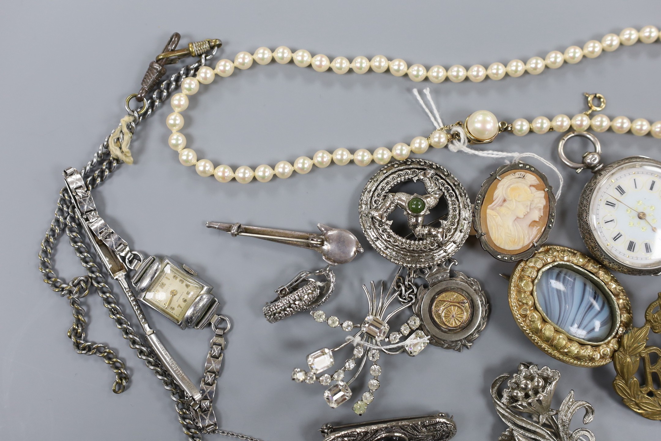 A mixed group of assorted silver and costume jewellery including a silver albert, Scottish hardstone brooch and two silver medallions, a silver fob watch, a white metal open faced pocket watch and a lady's steel Talis wr